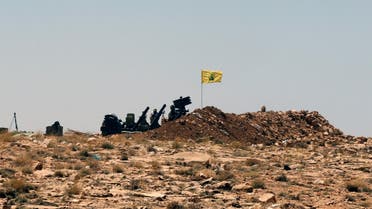A Hezbollah flag is seen at Juroud Arsal, Syria-Lebanon border