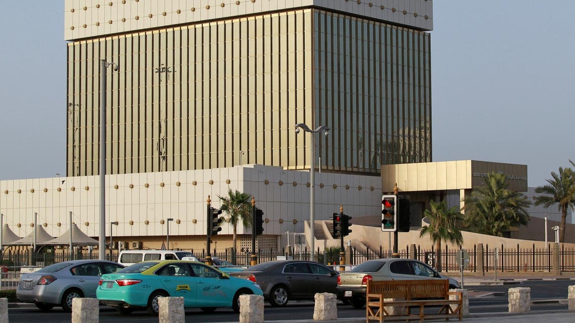 Cars drive past the building of Qatar Central Bank in Doha, Qatar, June 6, 2017. (Reuters)