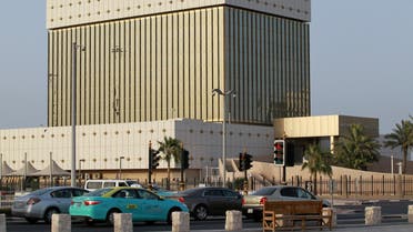 Cars drive past the building of Qatar Central Bank in Doha, Qatar, June 6, 2017. (Reuters)