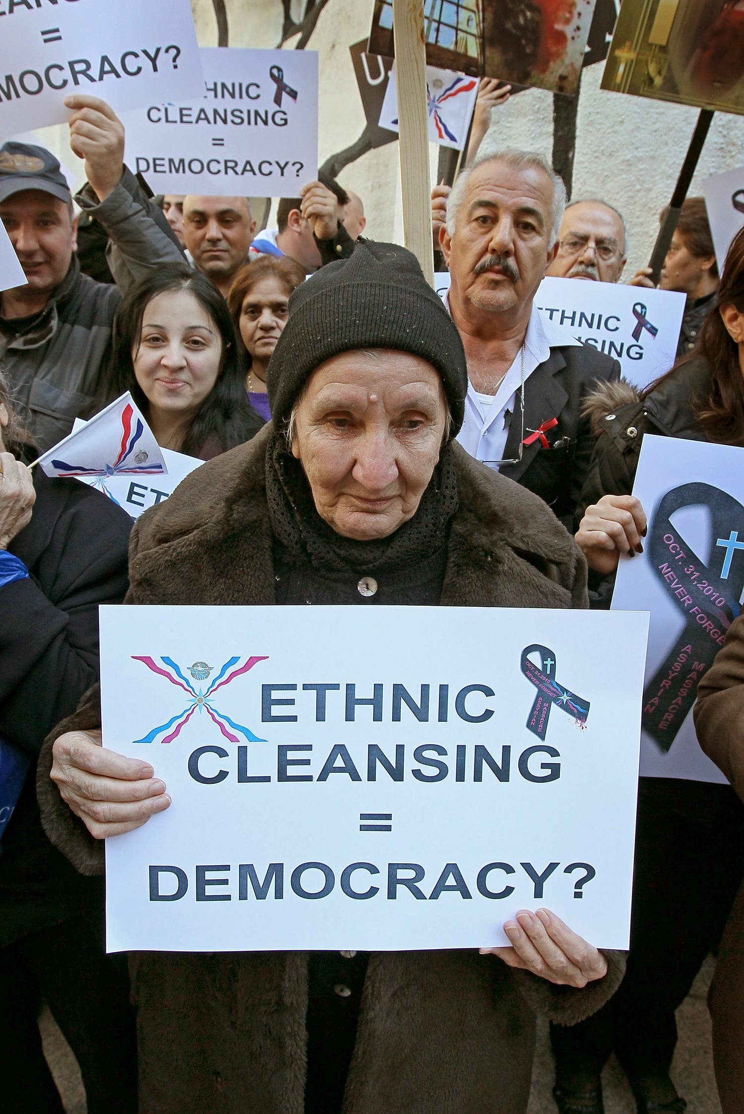 Surma Shamtir, originally from Bagdad, during a demonstration calling on the American and Iraqi governments to protect Iraqi Christians during a downtown rally November 8, 2010 in Chicago, Illinois. (AFP)