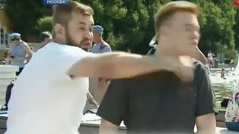 Russian TV reporter punched in the face live on air