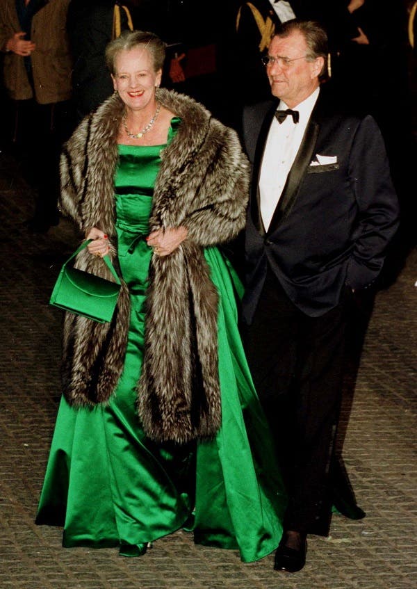 Danish Queen Margrethe II (L) and her husband Prince Henrik arrive at the Royal Palace in Amsterdam January 31. (Reuters)