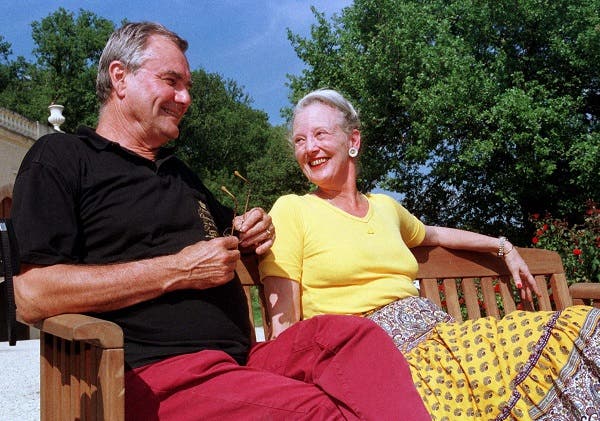 Denmark's Queen Margrethe II (R) and her husband Prince Consort Henrik de Montpezat (L) share a laugh as they relax during their holidays at their Castle of Cax, September 16. (Reuters)