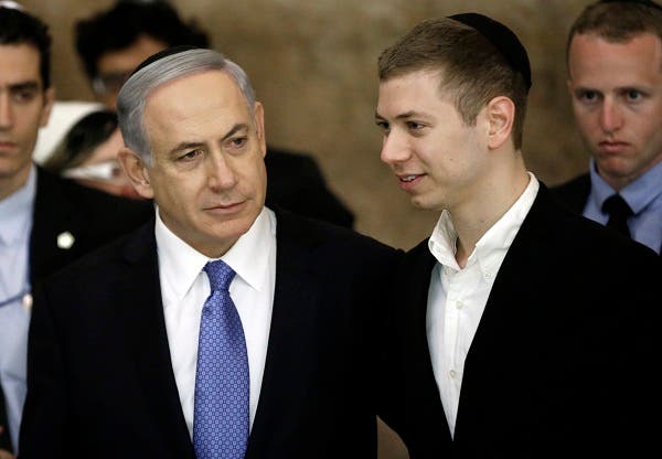 Israeli Prime Minister Benjamin Netanyahu (L) and his son Yair visit, on March 18, 2015, the Wailing Wall in Jerusalem following his party Likud's victory in Israel's general election. (AFP)
