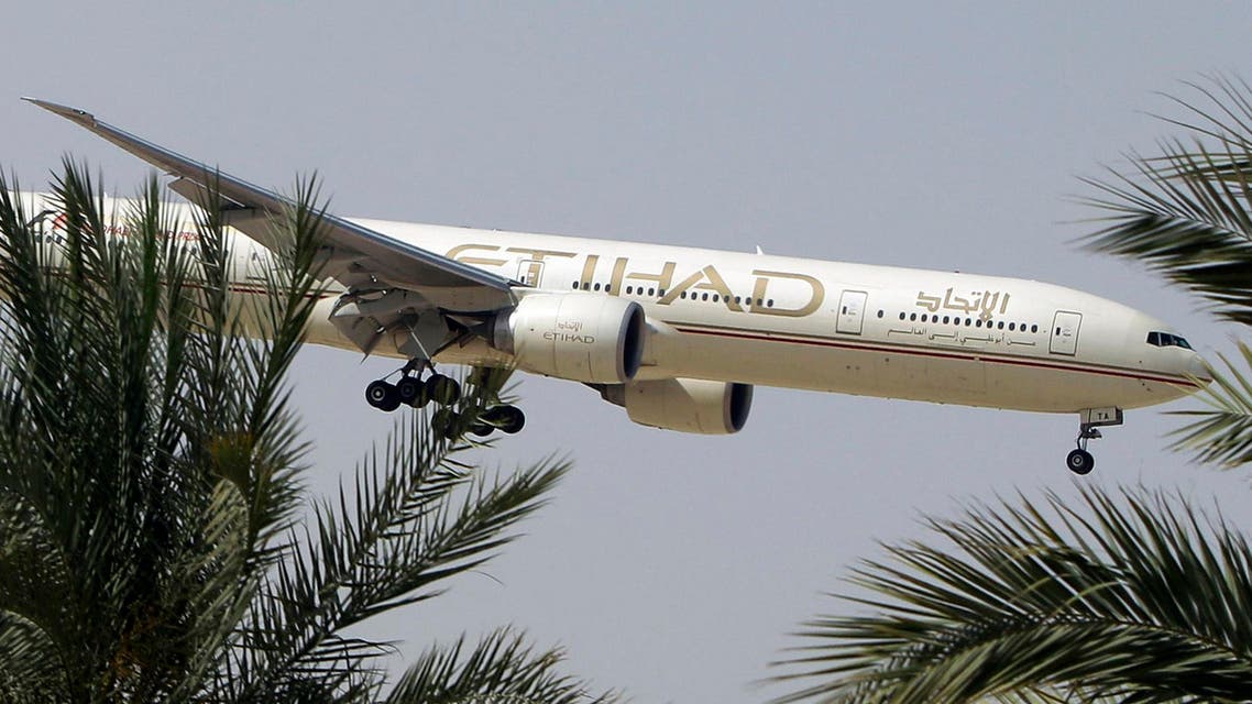 In this Sunday, May 4, 2014 file photo, an Etihad Airways plane prepares to land in Abu Dhabi Airport, United Arab Emirates. aP
