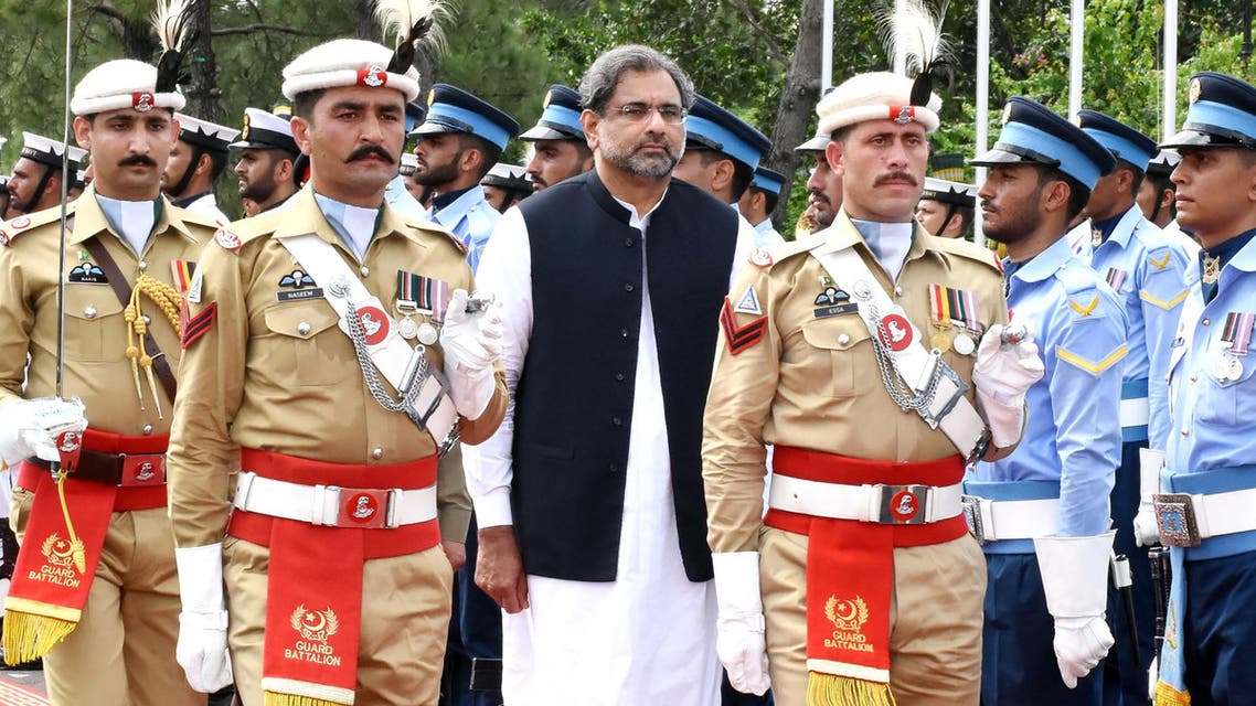 In this handout photograph released by Pakistan's Press Information Department (PID) on August 3, 2017, Pakistan's Prime Minister Shahid Khaqan Abbasi (C) reviews the honour guard during a welcome ceremony at the Prime Minister House in Islamabad. Pakistan's parliament elected ruling party loyalist Shahid Khaqan Abbasi as prime minister on August 1, after Nawaz Sharif's ouster by the Supreme Court following a corruption probe. Abbasi is seen as a placeholder for Sharif's designated successor, his younger brother Shahbaz, who must first be elected to the 342-member National Assembly before taking the top office. HANDOUT / PID / AFP