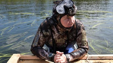 Russian President Vladimir Putin rests after swimming during the hunting and fishing trip which took place in the republic of Tyva in southern Siberia, Russia. (Reuters)