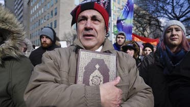 A Muslim man crying after hearing the names of the victims of the Quebec mosque attack during a rally in front of the US Consulate on February 4, 2017 in Toronto, Canada. (Shutterstock)