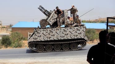 Lebanese army soldiers ride on a military tank in Labwe, at the entrance of the border town of Arsal, in Bekaa Valley, Lebanon July 27, 2017. (Reuters)