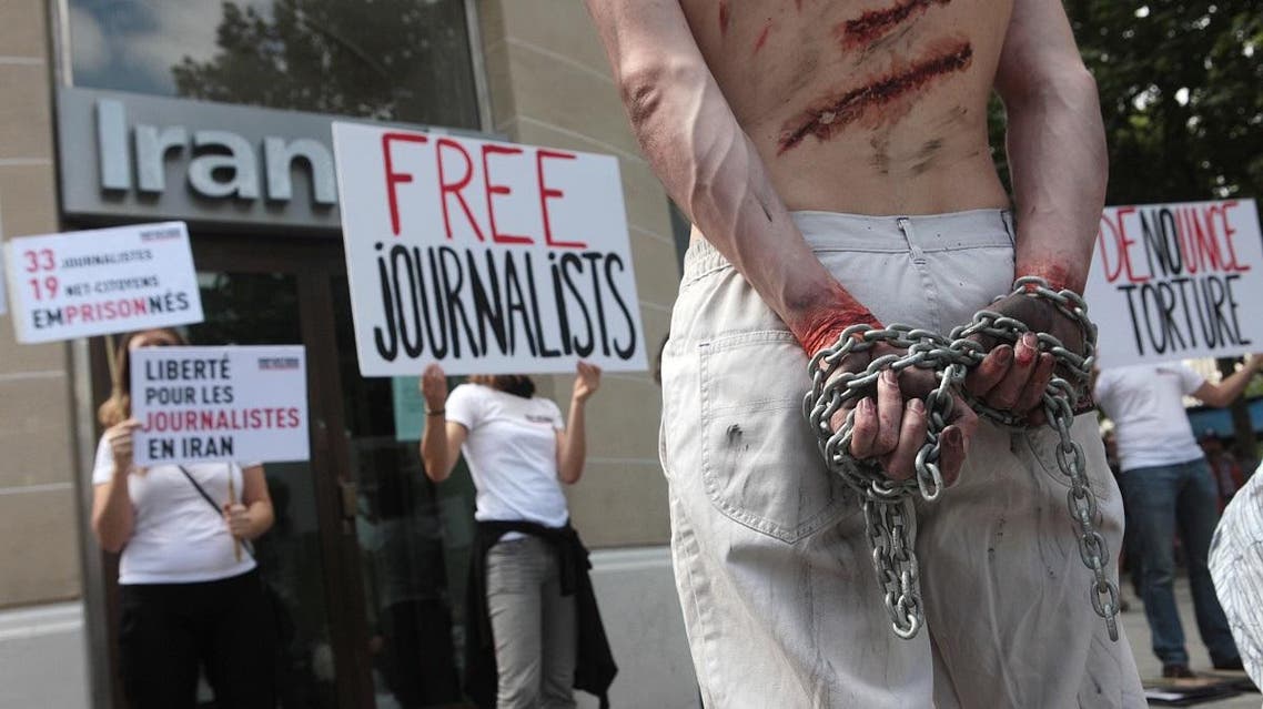 Reporters Without Borders (Reporters Sans Frontieres- RSF) activists take part in a protest in front of an Iran Air agency in Paris. (File photo: AFP)