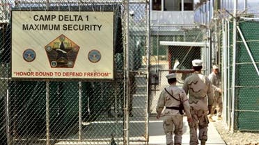 US military guards walk within Camp Delta military-run prison, at the Guantanamo Bay U.S. Naval Base, Cuba. (AP)
