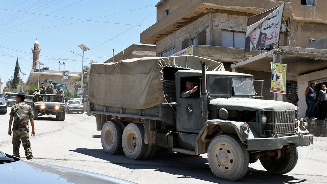 A convoy of Lebanese army soldiers drives at the entrance of the border town of Arsal, in eastern Bekaa Valley, Lebanon June 30, 2017.(Reuters)
