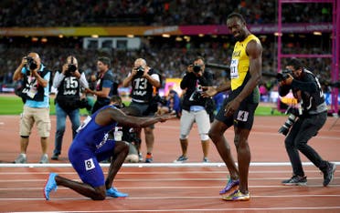 Usain Bolt of Jamaica with Justin Gatlin of the US after the final in World Athletics Championships Men’s 100 meters final in London on August 5, 2017. (Reuters) 