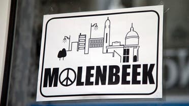 In this Nov. 18, 2015 file photo, a sign in a shop window reads Molenbeek, with a peace sign, on the main shopping street of Molenbeek, Belgium. (AP)