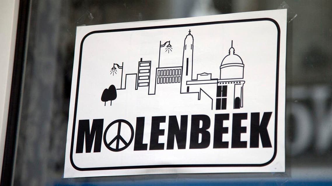 In this Nov. 18, 2015 file photo, a sign in a shop window reads Molenbeek, with a peace sign, on the main shopping street of Molenbeek, Belgium. (AP)