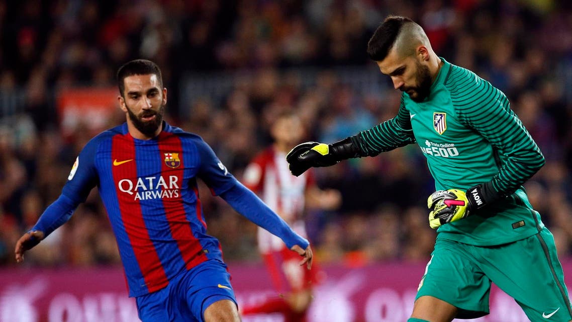 Barcelona forward Arda Turan (left) is looking for more playtime this season and a return to Galatasaray may be possible. (Reuters)