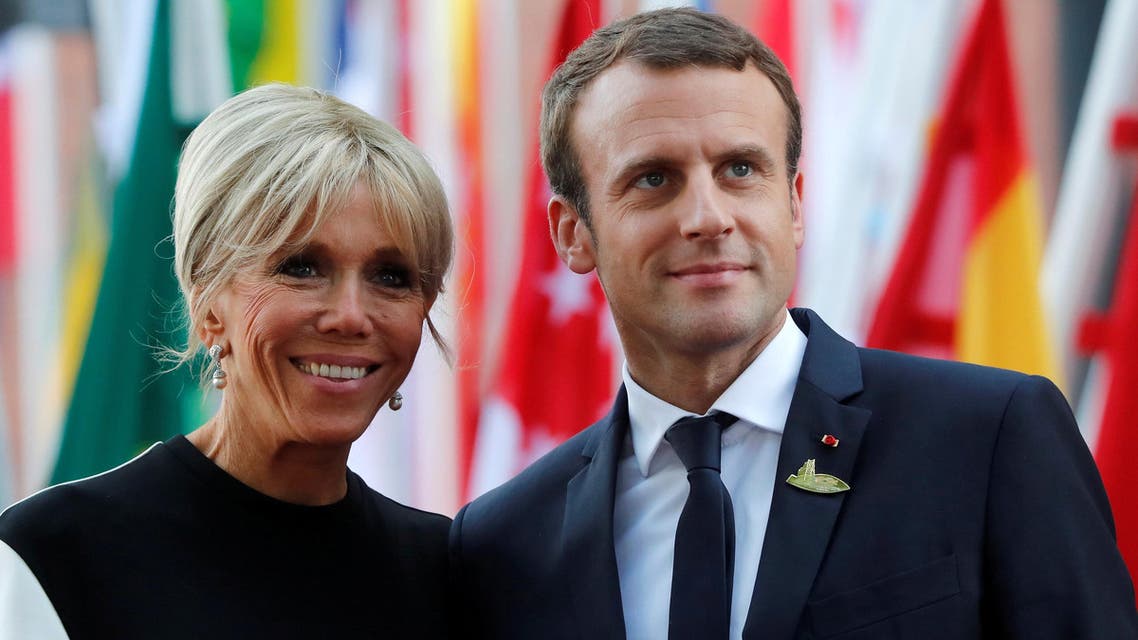 FILE PHOTO - French President Emmanuel Macron and hiw wife Brigitte Macron are seen July 7, 2017 at the G20 summit in Hamburg, Germany. Picture taken July 7, 2017. REUTERS/Wolfgang Rattay/File Photo