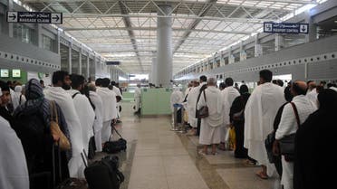 Pakistani Muslims wait to pass security as the first pilgrims for the annual Hajj pilgrimage arrive in Jeddah on July 24, 2017. afp