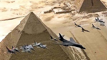 Fighter aircraft, led by a USAF B1-B tactical bomber, fly over the 4,500-year-old pyramids October 25 during the Bright Star 99 manoeuvres. (Reuters)