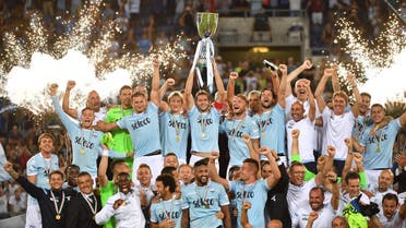Lazio's players celebrate with the trophy after winning the Italian SuperCup TIM football match Juventus vs lazio on August 13, 2017 at the Olympic stadium in Rome. AFP