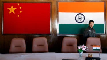 A man walks inside a conference room used for meetings between military commanders of China and India in the northeastern Indian state of Arunachal Pradesh, November 11, 2009. (Reuters)