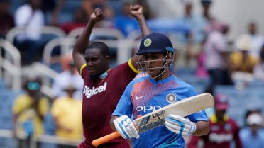 India’s MS Dhoni leaves the field after being dismissed by West Indies’Jerome Taylor during a T20 International in Kingston, Jamaica, Sunday, on July 9, 2017. (AP)