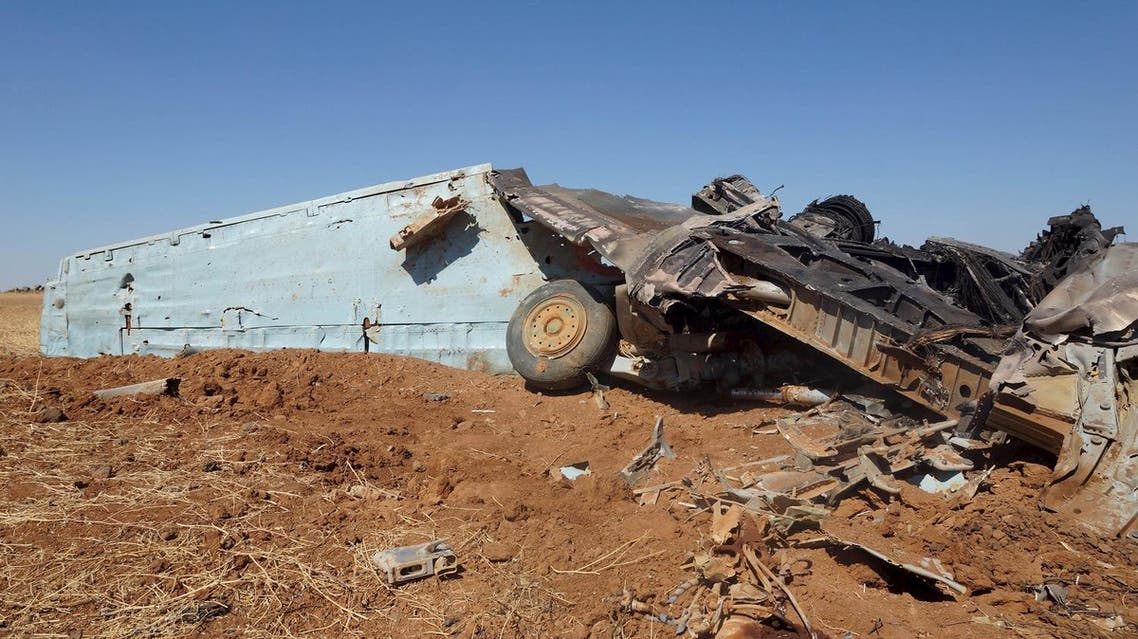 A plane that belongs to forces loyal to Syria's President Bashar Al-Assad after it crashed in Daraa, Syria June 11, 2015. (Reuters)