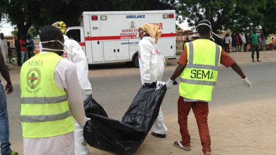 Rescue workers remove the body of a victim after a suicide bomb attack at a camp for people displaced by Islamist extremist in Maiduguri, Nigeria, Monday, July. 24, 2017. (AFP)