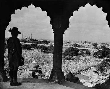 In this Aug. 15, 1948 file photo, an armed Gurkha towers over thousands Indians in a courtyard beneath the Red Fort celebrating the first anniversary of India’s independence, in New Delhi. (AP)