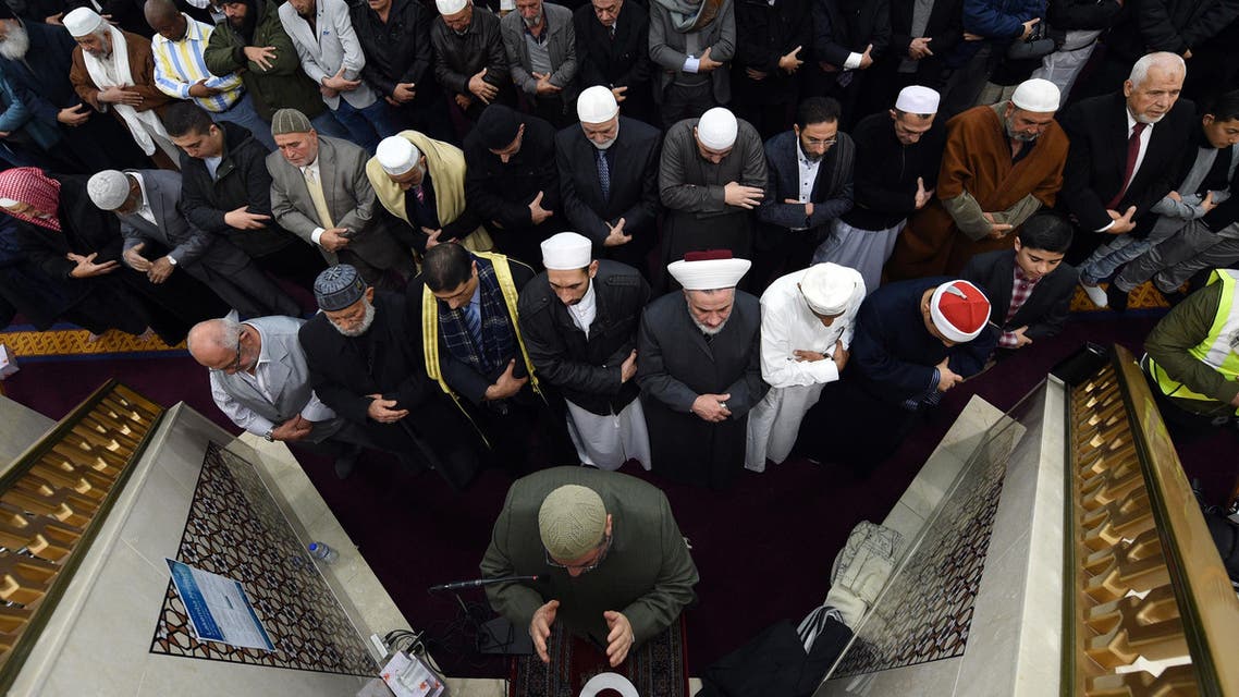 Sheikh Yahya Safi (bottom C), imam of the Lekamba mosque, leads an Eid al-Fitr prayer at the Lekamba mosque in western Sydney on June 25, 2017. (AFP)