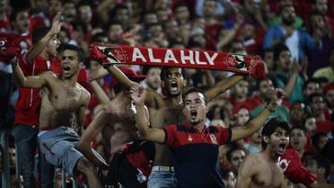 Fans of Egypt's Al Ahly cheer on their team during their African Champions League (CAF) group stage football match with Cameroon's Cotonsport, at Borg el-Arab Stadium near Alexandria on July 8, 2017. (AFP)