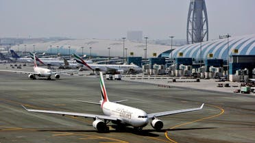 FILE - In April 20, 2010 file photo, an Emirates airline passenger jet taxis on the tarmac at Dubai International airport in Dubai, United Arab Emirates. Emirates said it is suspending flights to Qatar amid a growing diplomatic rift. The airline said on its website Monday, June 5, 2017, that flights would be suspended until further notice starting Tuesday. (AP Photo/Kamran Jebreili, File)