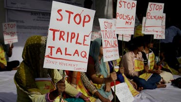 Activists of various social organizations hold placards during a protest against “Triple Talaq”, in New Delhi, India, on May 10, 2017. (AP)