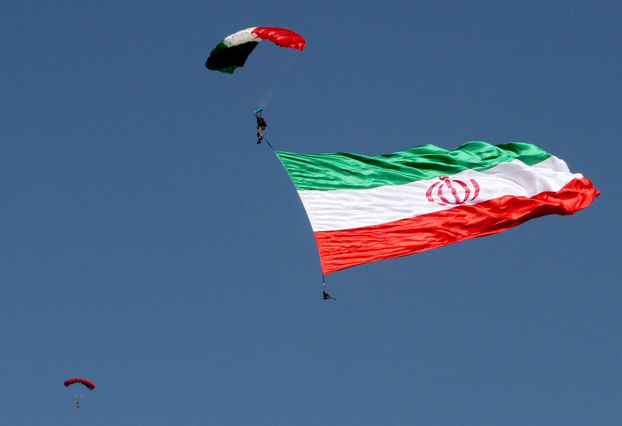 Iranian paratroopers perform during a parade marking the country’s Army Day, on April 18, 2017, in Tehran. (AFP)