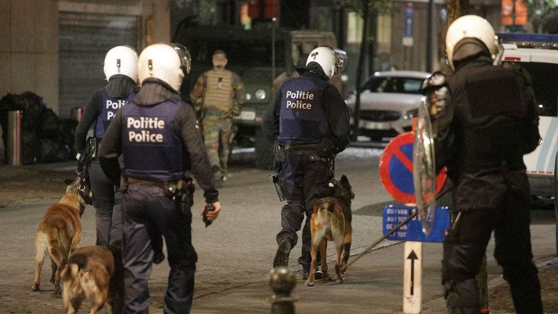 Belgian police with dogs and Belgian Army soldiers. (AP)