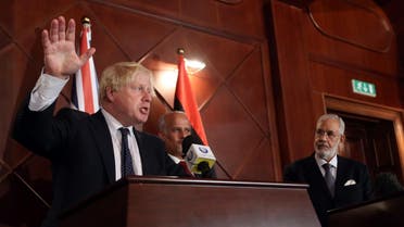 Boris Johnson speaks during a press conference with Mohamed al-Taher Siala (R), Foreign Minister of the UN-backed Libyan Government of National Accord, in Tripoli on August 23, 2017. (AFP)