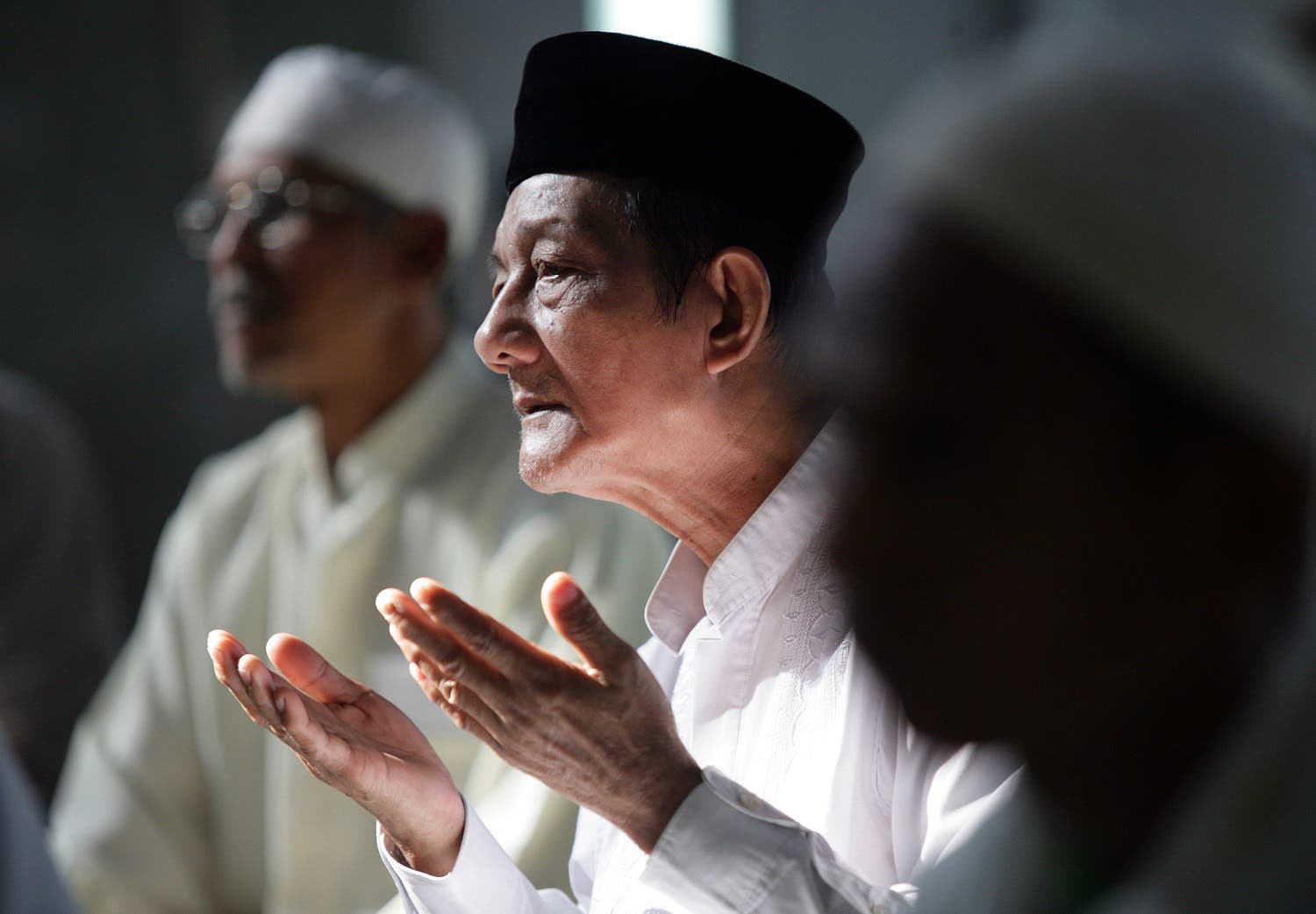 A group of Indonesian Muslims hold a mass prayer at a mosque in Jakarta on July 12, 2009 in support of Muslim Uighurs, following the recent deadly rioting which left more than 180 people dead in China’s Xinjiang region. (AFP)