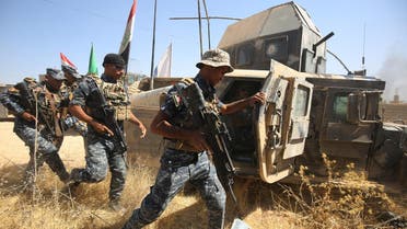 Members of the Iraqi forces advance through Tal Afar on August 24, 2017. (AFP)