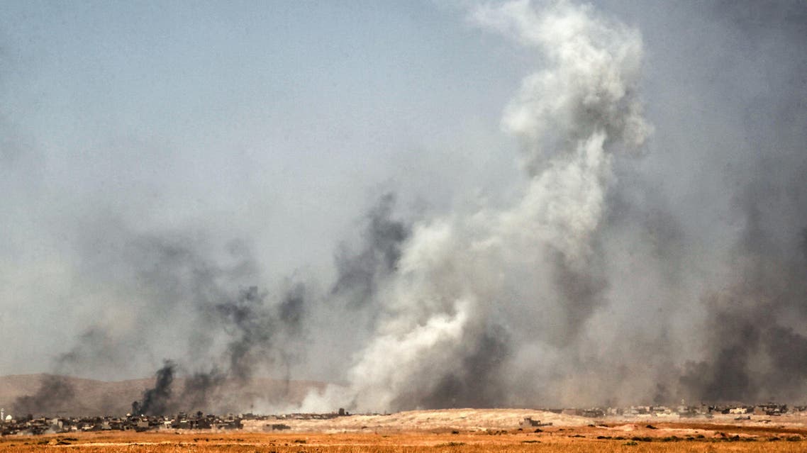 Smoke billows as Iraqi forces, backed by the Hashed al-Shaabi (Popular Mobilisation units), advance inside the town of Tal Afar, west of Mosul. (AFP)