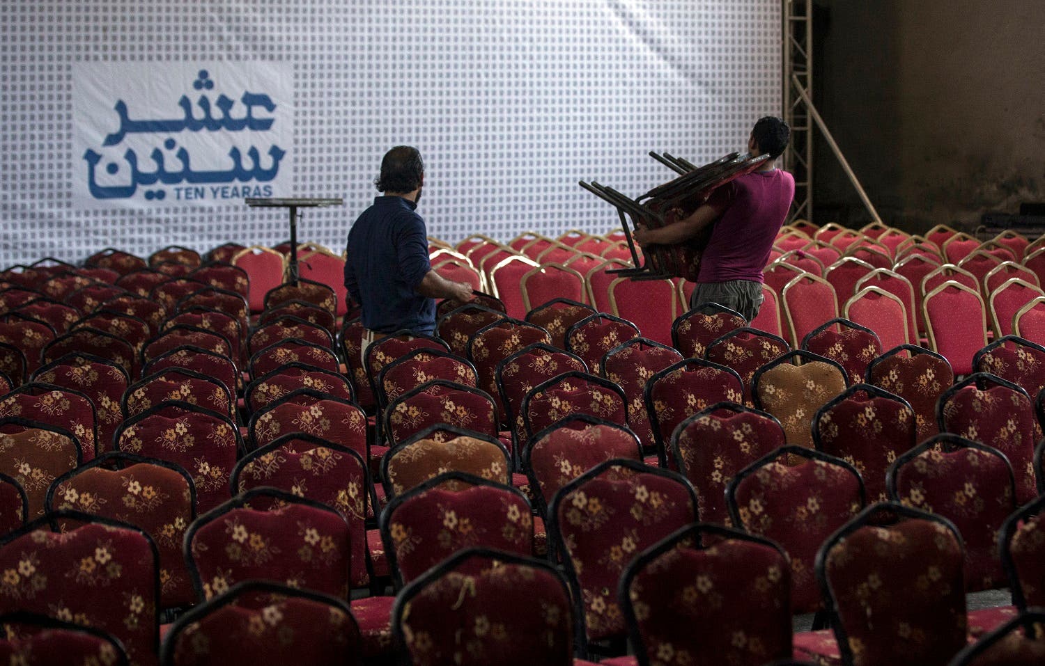 Palestinian workers prepare the hall for the screening of ‘10 Years’ at Samer Cinema in Gaza City on August 26, 2017. (AFP)