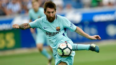 Lionel Messi, kicks the ball to score a goal during the Spanish La Liga soccer match between FC Barcelona and Deportivo Alaves. (AP)