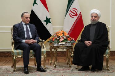 President Hassan Rouhani with Syrian Prime Minister Imad Khamis at his office in Tehran, on Jan. 18, 2017. (Iranian Presidency Office via AP)