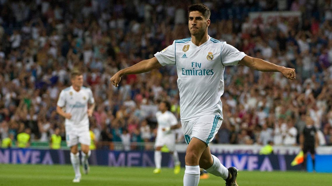 Real Madrid's midfielder Marco Asensio celebrates after scoring during the Spanish league football match Real Madrid CF vs Valencia CF at the Santiago Bernabeu stadium in Madrid on August 27, 2017. (AFP)