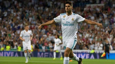 Real Madrid's midfielder Marco Asensio celebrates after scoring during the Spanish league football match Real Madrid CF vs Valencia CF at the Santiago Bernabeu stadium in Madrid on August 27, 2017. (AFP)