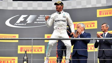 Winner Mercedes' British driver Lewis Hamilton celebrates on the podium after the Belgian Formula One Grand Prix at the Spa-Francorchamps circuit in Spa on August 27, 2017. AFP