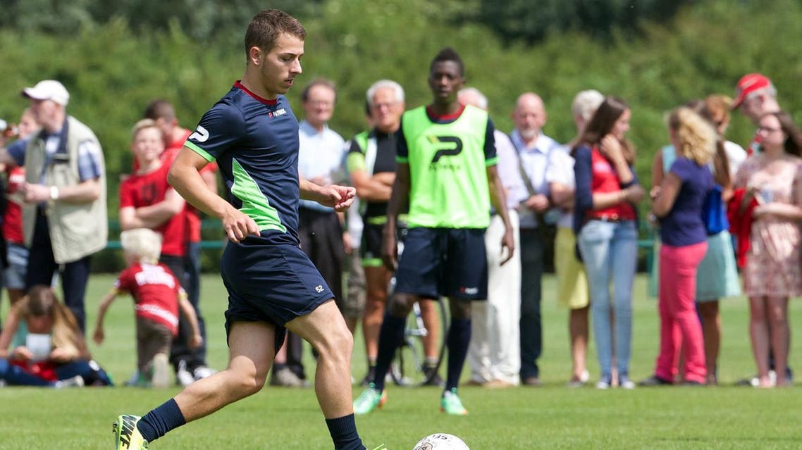 Essevee's new player Kylian Hazard takes part in a training session of the Belgian first division soccer team Zulte Waregem, the first training for the 2014-2015 season, on June 21, 2014 in Waregem. AFP PHOTO / BELGA / KURT DESPLENTER