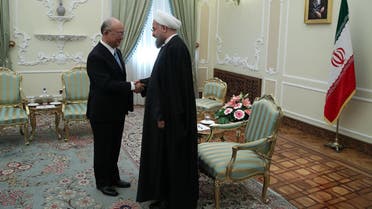 President Hassan Rouhani (R) greeting Yukiya Amano (L), Director General of the IAEA, in Tehran on December 18, 2016. (AFP)