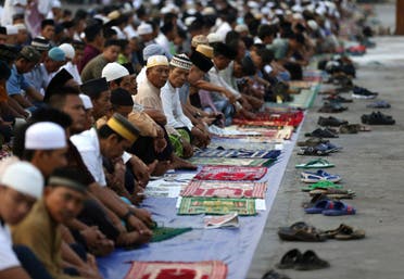 Muslim men attend a morning prayer marking Eid al-Adha holiday at Sunda Kelapa Port in Jakarta, Indonesia, Friday, Sept. 1, 2017. (AP)