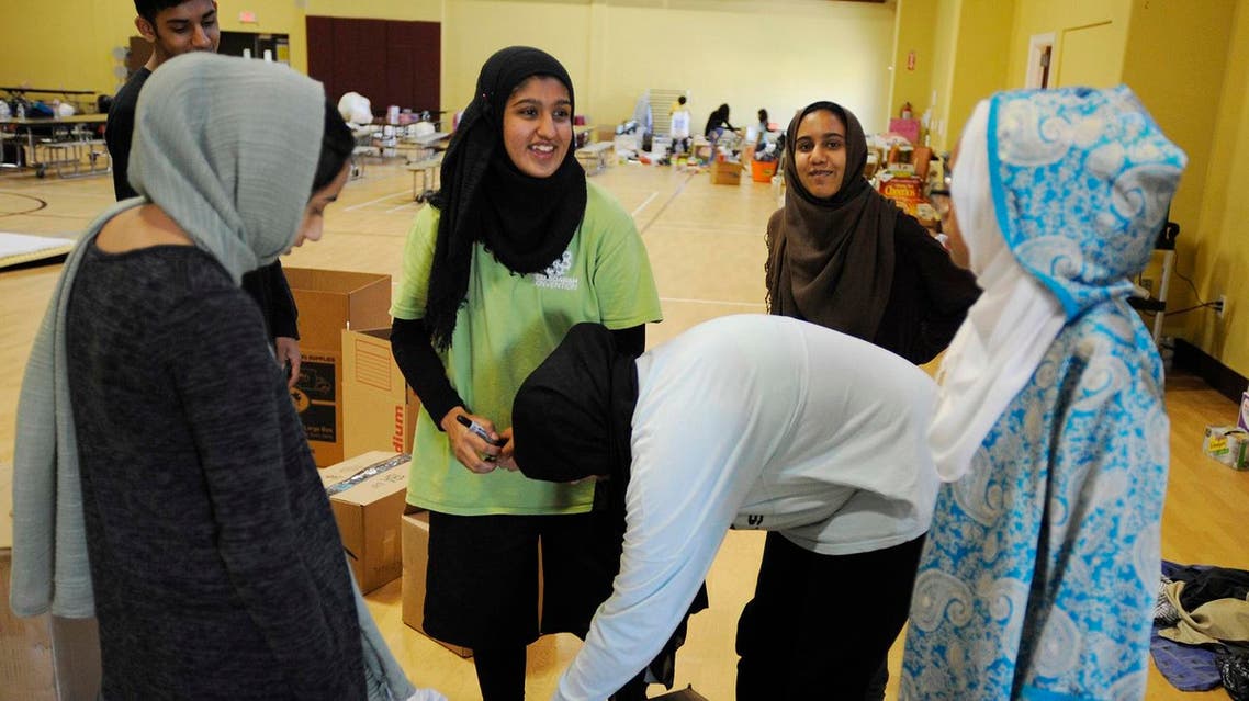 In this Thursday, Aug. 31, 2017, photo, volunteers with the Islamic Society of Greater Houston, package donations at a mosque that was being used as a shelter. (AP)