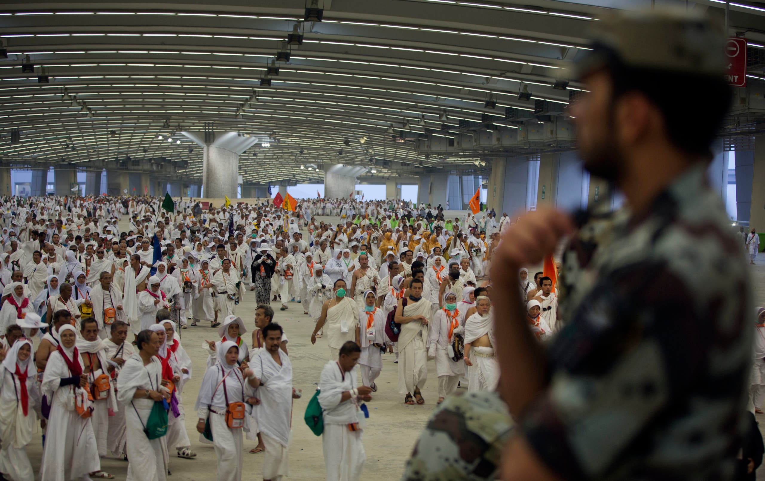 Muslim pilgrims walk on the way to cast stones at the huge stone pillar in the symbolic stoning of the devil in Mina, outside the holy city of Mecca, Saudi Arabia, Friday, Sept. 1, 2017. (AP)